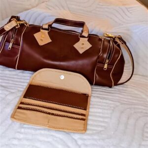 handcrafted genuine leather gray and red duffle bag with matching wallet